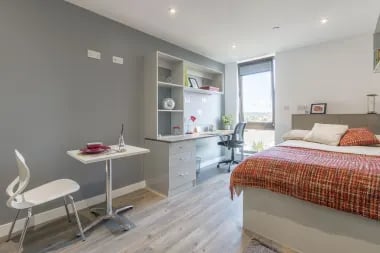 Modern student studio with bed desk and table bedroom at Glendower House in Cardiff Student Accommodation