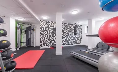 Treadmills weight machines and exercise balls gym area at Glendower House in Cardiff Student Accommodation