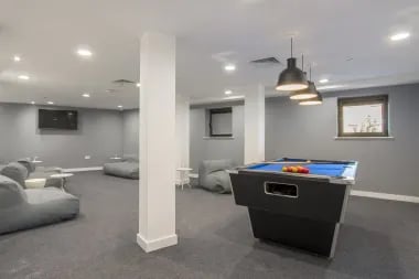 Pool table and seating area common room at Glendower House in Cardiff Student Accommodation