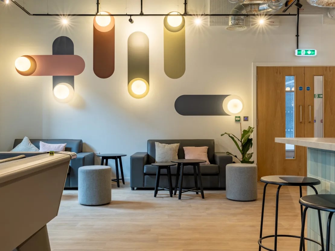 Pool table sofas stools and wall lights communal area at The Waterways Nottingham in Nottingham Student Accommodation