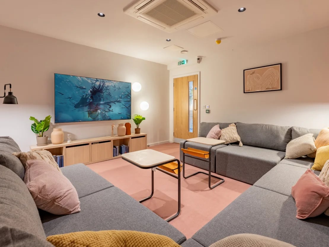 Large grey sectional sofa with TV living room at The Waterways Nottingham in Nottingham Student Accommodation