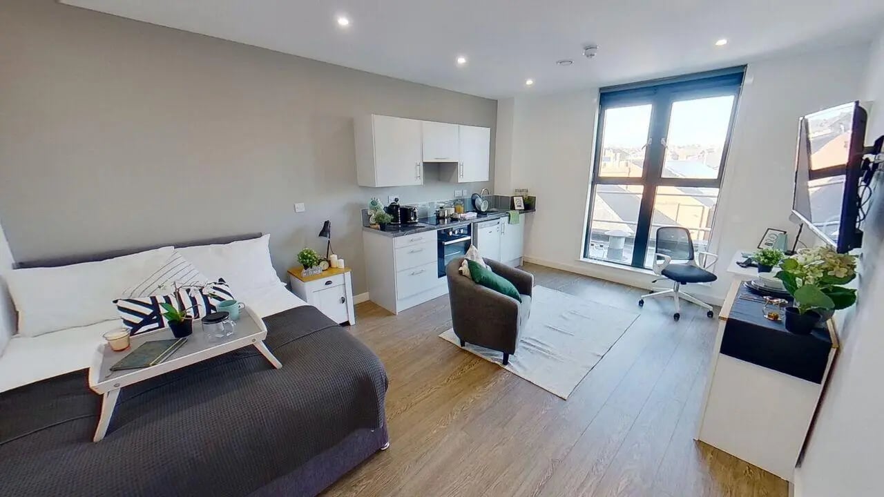 Bed kitchen armchair desk television studio apartment at St Marks Court - Nottingham in Nottingham Student Accommodation