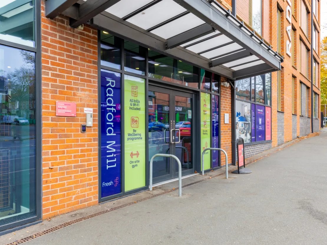 Radford Mill entrance with gym and parking signs exterior at Radford Mill in Nottingham Student Accommodation