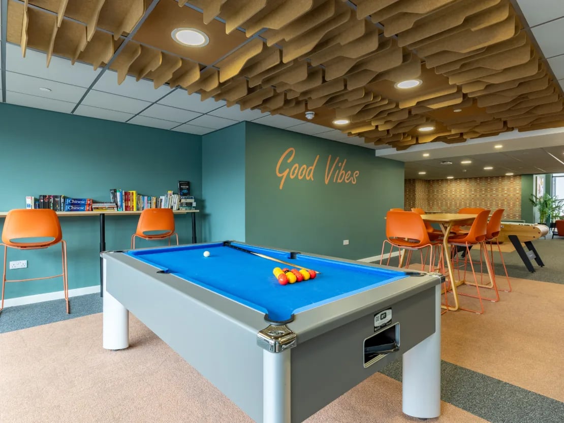 Pool table orange chairs and books common room at Radford Mill in Nottingham Student Accommodation