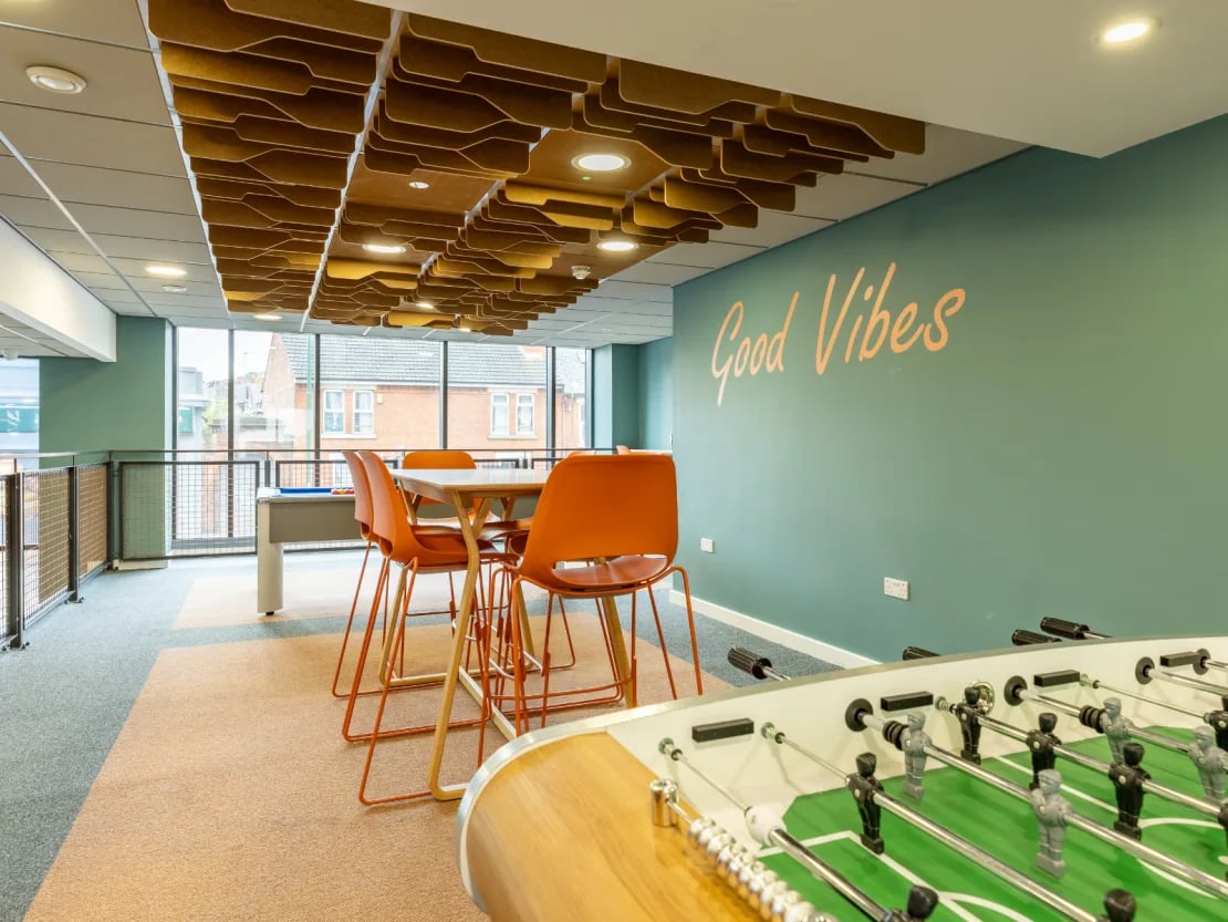 Foosball table table chairs good vibes communal area at Radford Mill in Nottingham Student Accommodation