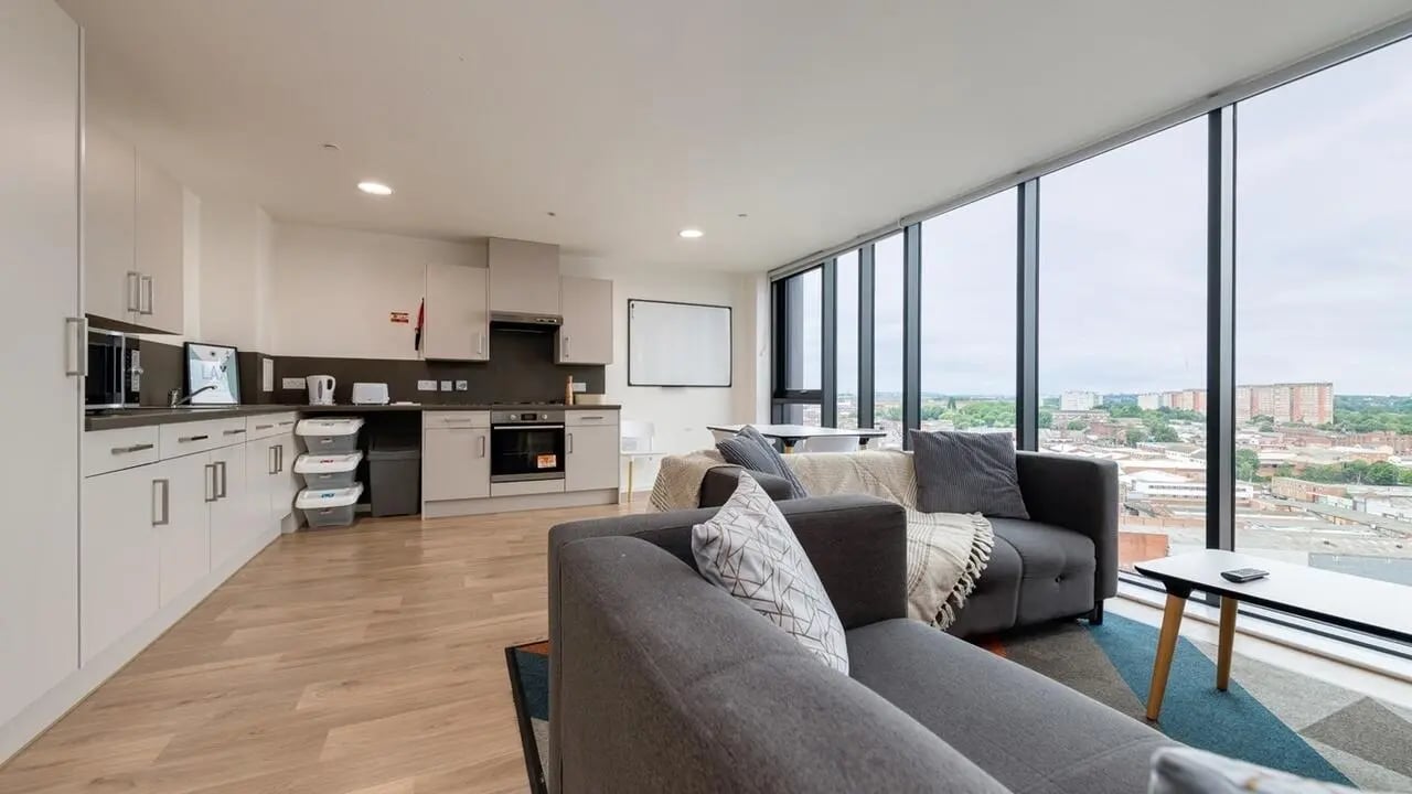 Kitchen living area sofas and large window living room at Collegiate Bagot Street in Birmingham Student Accommodation