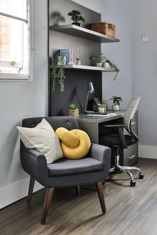 Armchair with pillows desk chair and shelves Study area at The Hahnemann Building in Liverpool Student Accommodation