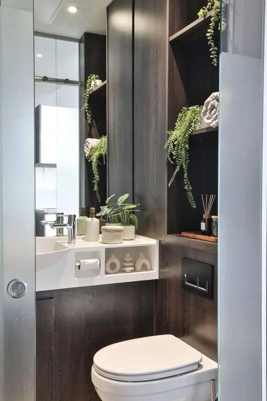 Toilet sink and shelves with plants Bathroom at The Hahnemann Building in Liverpool Student Accommodation