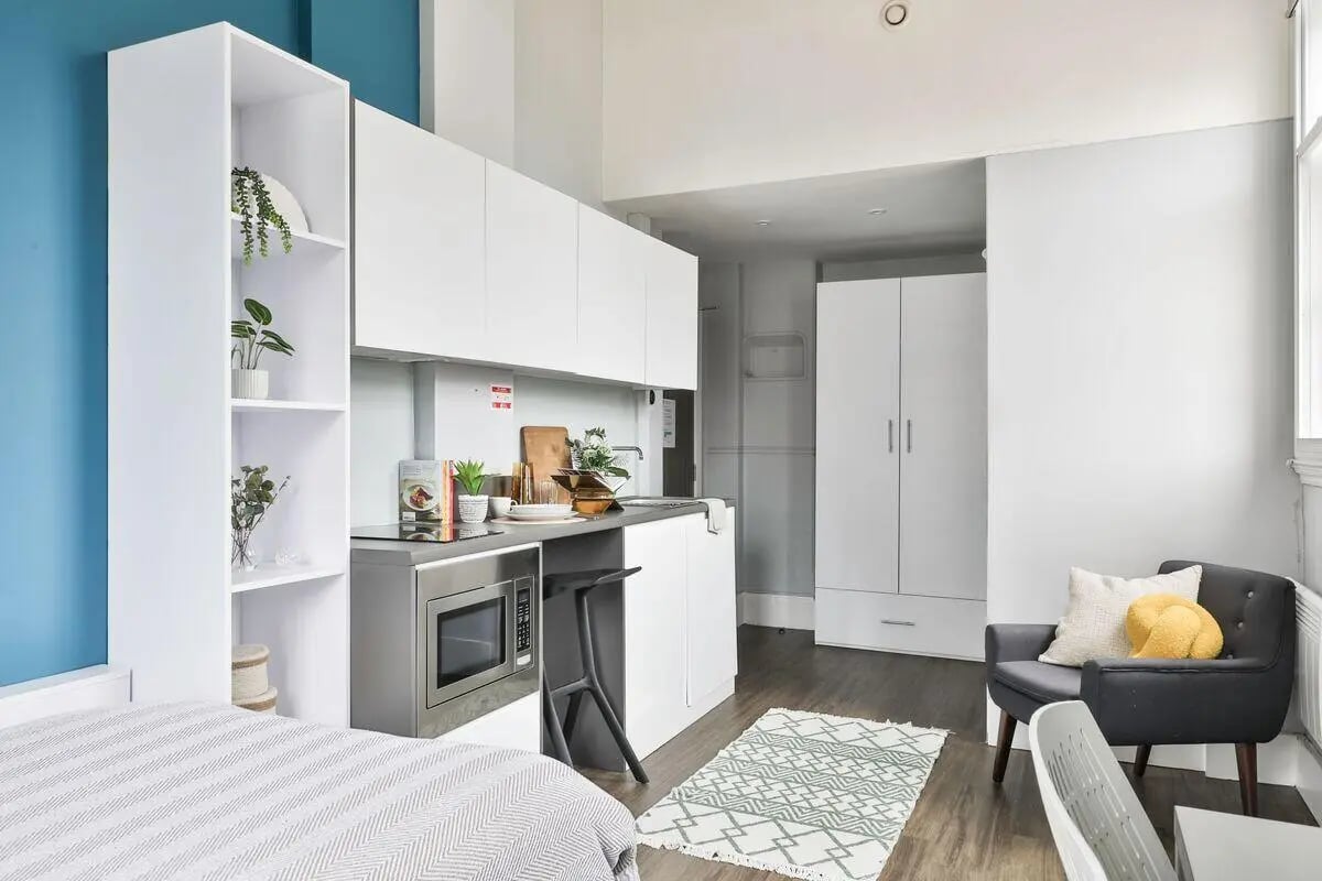 Studio apartment with bed microwave kitchen chair Living room at The Hahnemann Building in Liverpool Student Accommodation