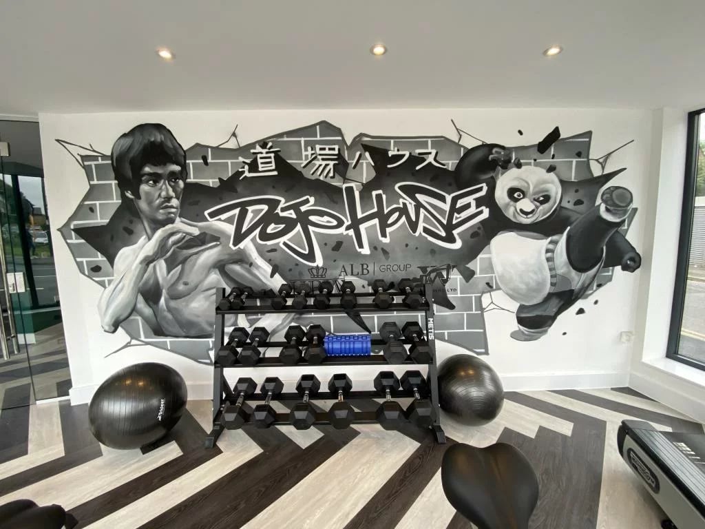 Gym with mural dumbbells and exercise balls gym at Dojo House Nottingham in Nottingham Student Accommodation