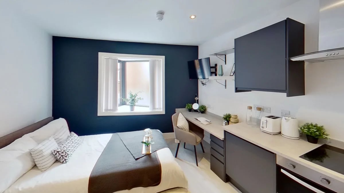 Bed desk TV kitchen appliances study area bedroom at Dojo House Nottingham in Nottingham Student Accommodation