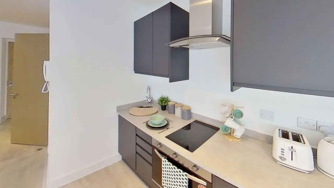 Modern kitchen with cabinets sink hob and toaster kitchen at Dojo House Nottingham in Nottingham Student Accommodation