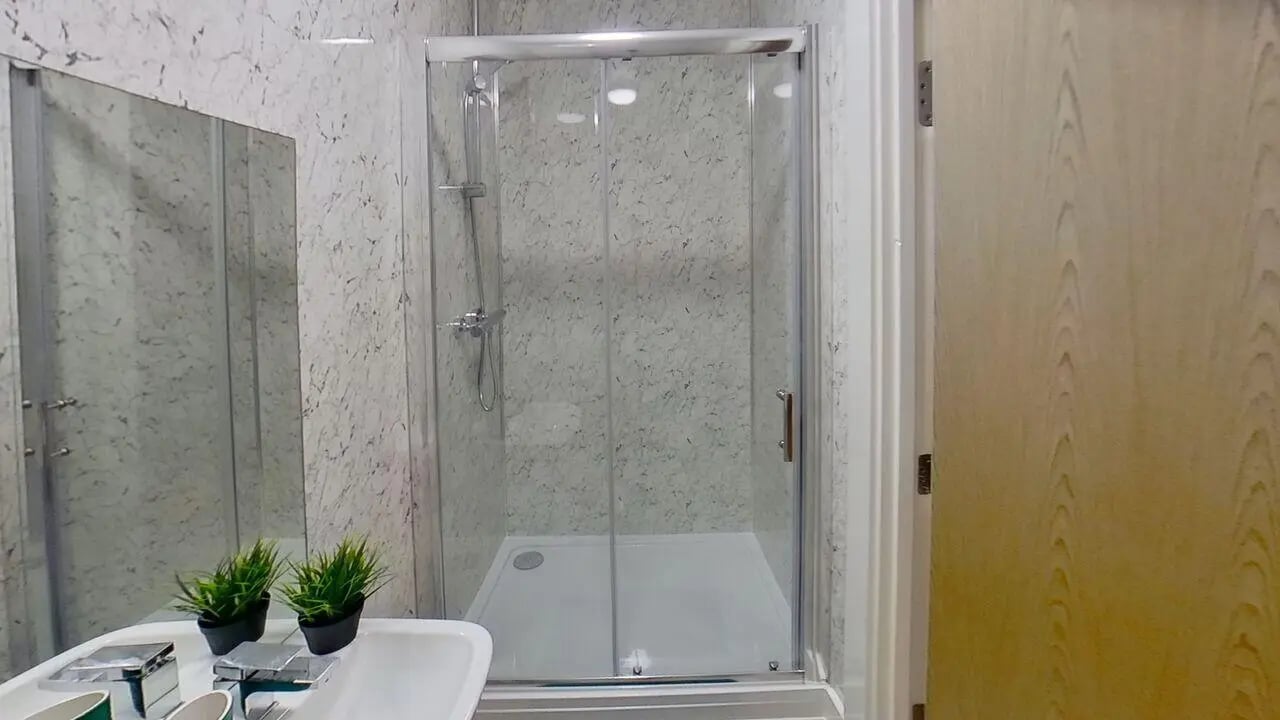 Shower cubicle sink mirror plants bathroom at Dojo House Nottingham in Nottingham Student Accommodation