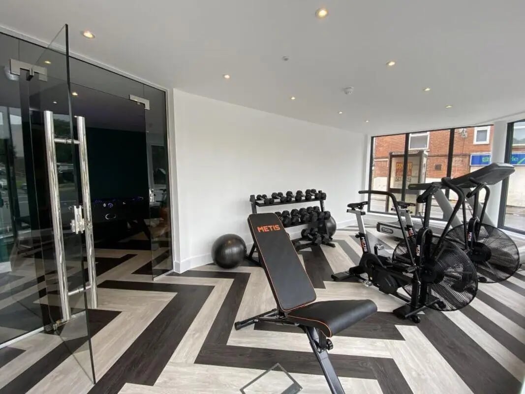 Dumbbells bench exercise bikes and treadmill gym at Dojo House Nottingham in Nottingham Student Accommodation