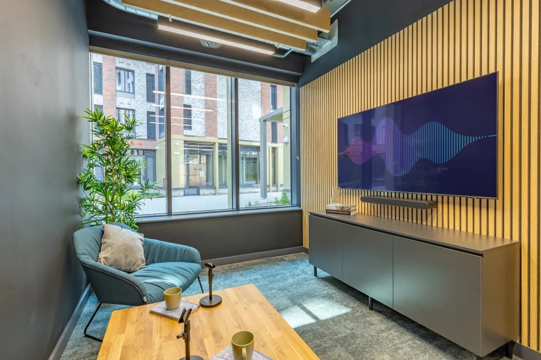 Armchair coffee table television unit and plant lounge area at Winfield Court in Nottingham Student Accommodation