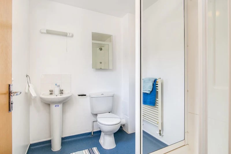 Sink toilet mirror towel rail bathroom at Parham Student Village in Canterbury Student Accommodation