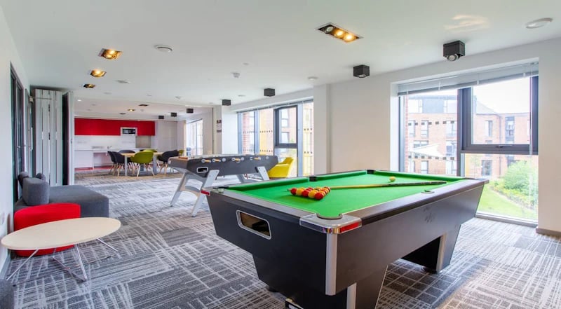 Pool table foosball table kitchen communal area at Duresme Court in Durham Student Accommodation