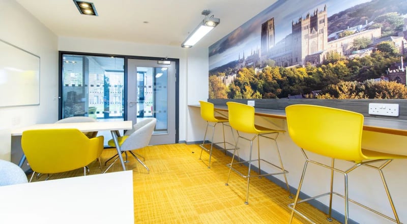 Yellow chairs tables mural and whiteboard study area at Duresme Court in Durham Student Accommodation
