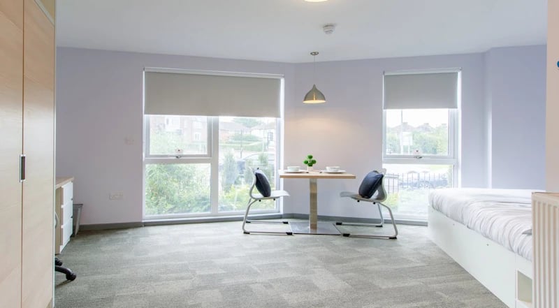 Bed desk and dining area in room at Duresme Court in Durham Student Accommodation
