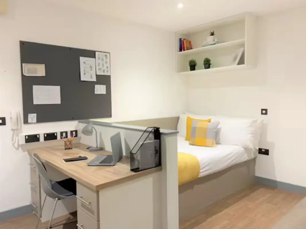 Desk bed whiteboard shelf bedroom study area at Great Patrick Street in Belfast Student Accommodation