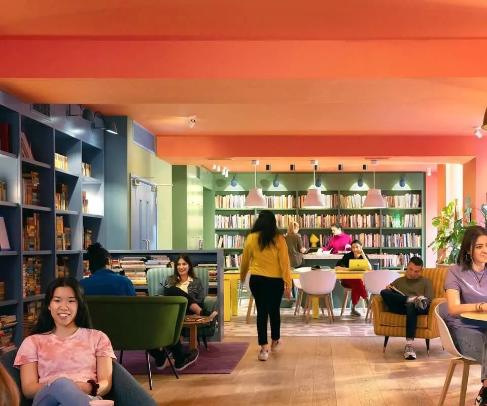 Students studying and relaxing in lounge area at Scape Bloomsbury in London Student Accommodation