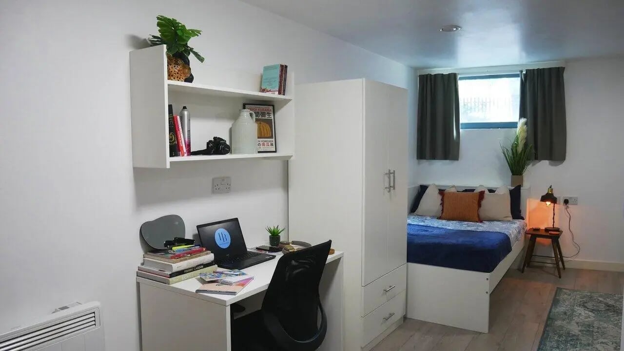 Desk bed wardrobe and shelving student room at Theatre House in Coventry Student Accommodation