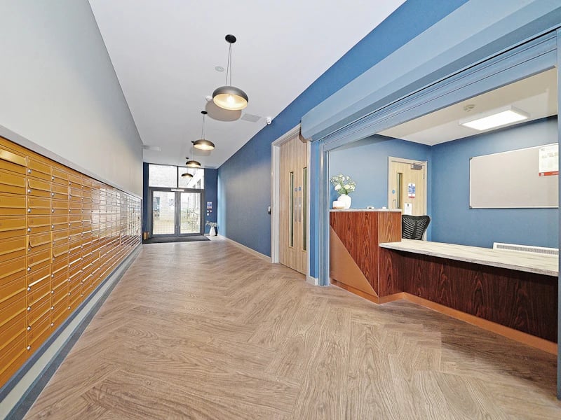 Mailboxes reception desk with chairs and door Entrance hall at Fontenoy Apartments in Liverpool Student Accommodation
