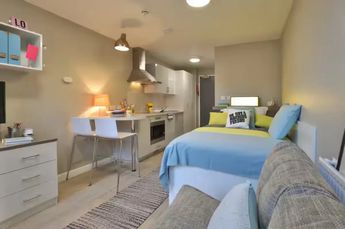 Studio apartment with bed kitchen and desk area at James House in Bath Student Accommodation