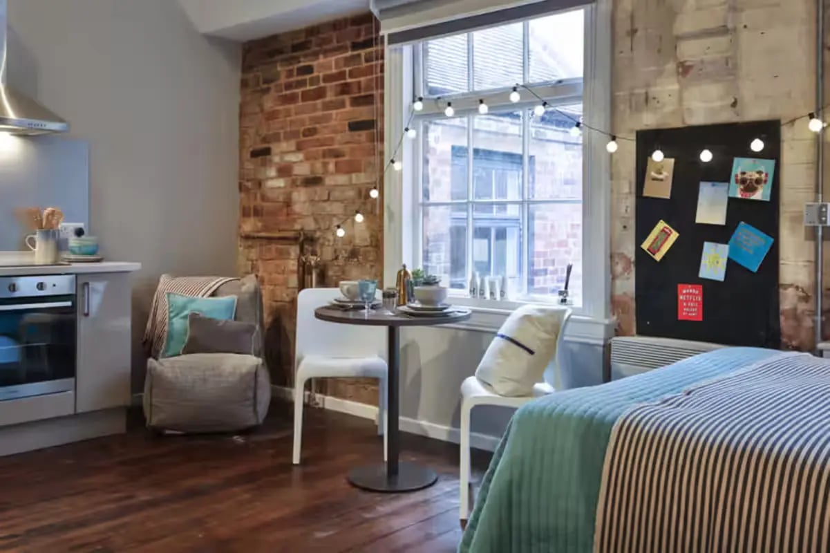 Kitchen beanbag table chairs bed area at The Emporium Birmingham in Birmingham Student Accommodation
