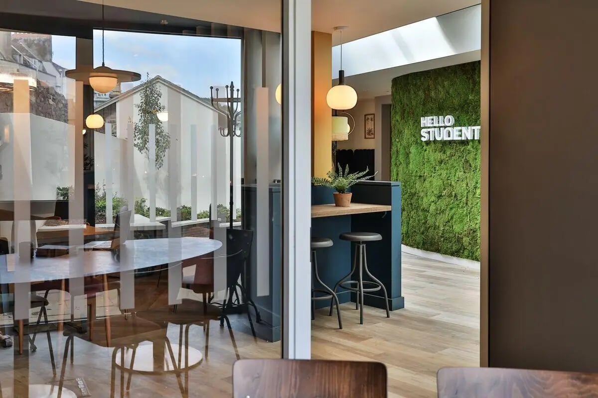 Study area with moss wall and bar counter at St Mary's in Bristol Student Accommodation
