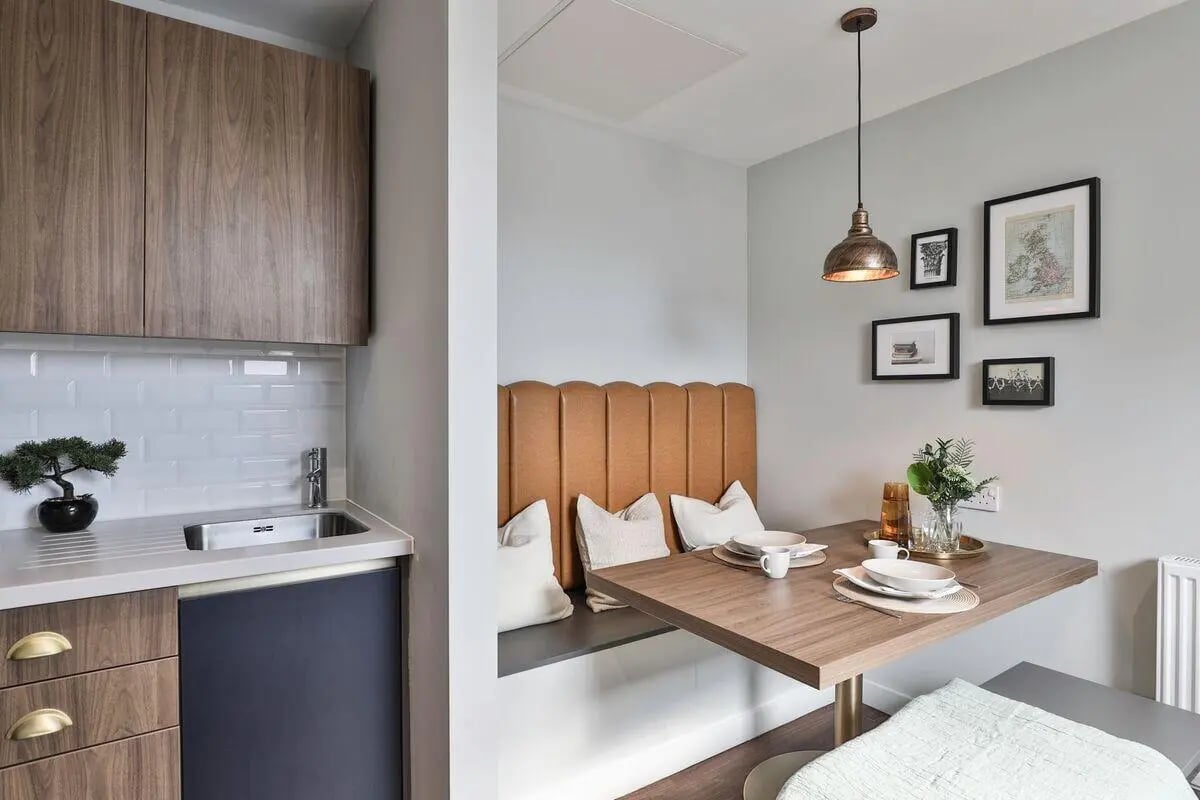 Kitchen sink dining bench with table living room at St Mary's in Bristol Student Accommodation
