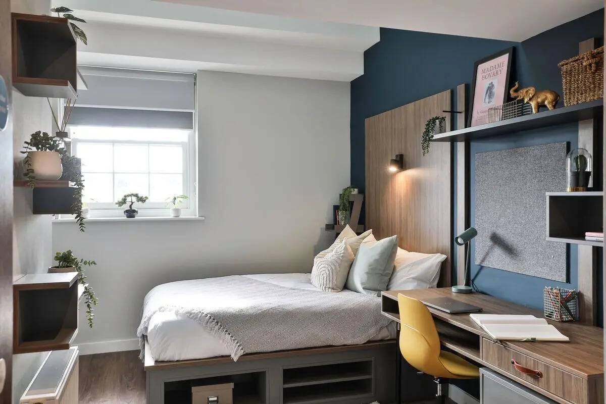 Bed desk plants and shelves bedroom at St Mary's in Bristol Student Accommodation