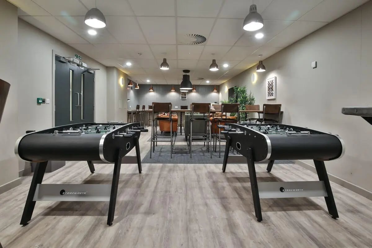 Foosball tables furniture and seating common area at William & Matthew House in Bristol Student Accommodation