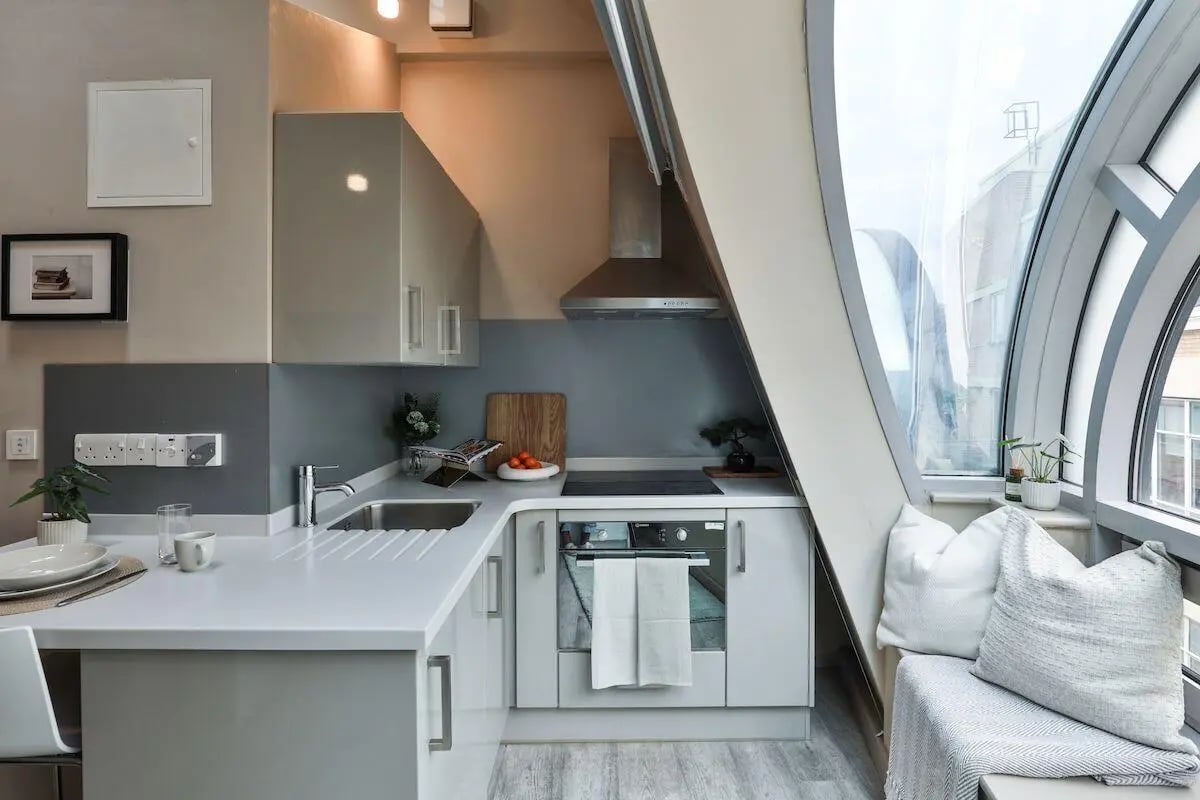 Modern kitchen with oven sink and window seating kitchen at William & Matthew House in Bristol Student Accommodation