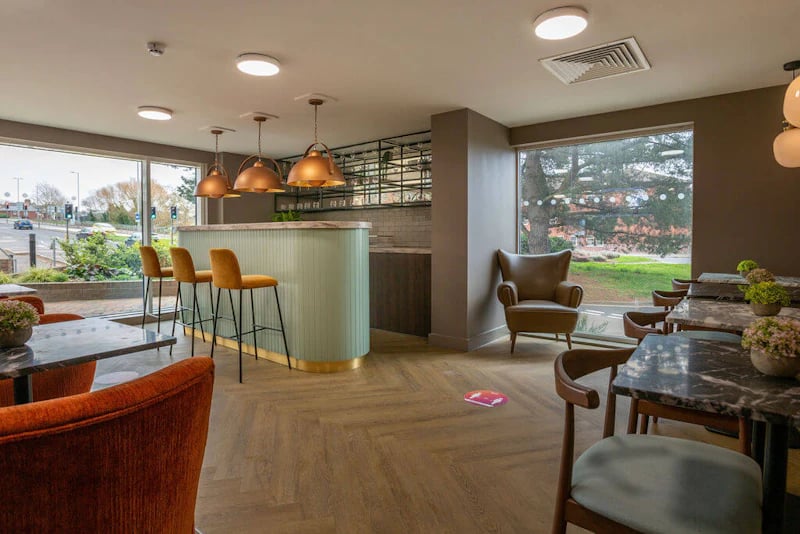 Bar area with chairs and tables living room at West Gate in Exeter Student Accommodation
