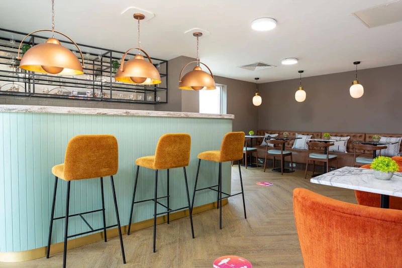 Bar with stools and seating area lounge at West Gate in Exeter Student Accommodation