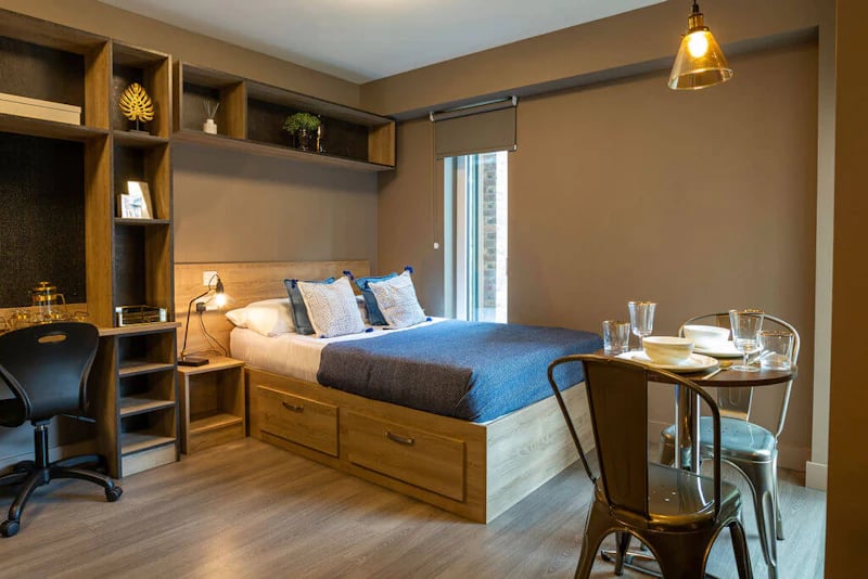 Bed desk shelves and dining table bedroom at West Gate in Exeter Student Accommodation