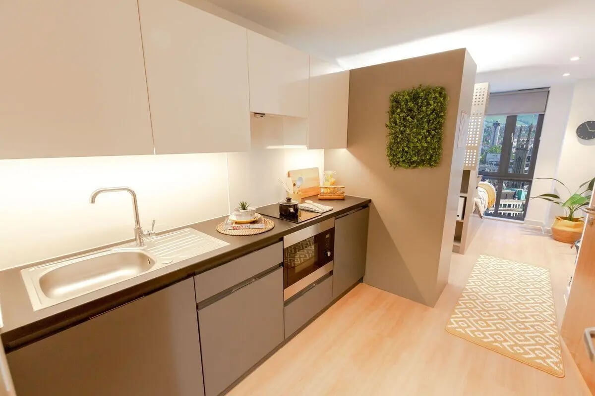 Sink oven microwave decorative plant kitchen at Market Quarter Studios in Bristol Student Accommodation