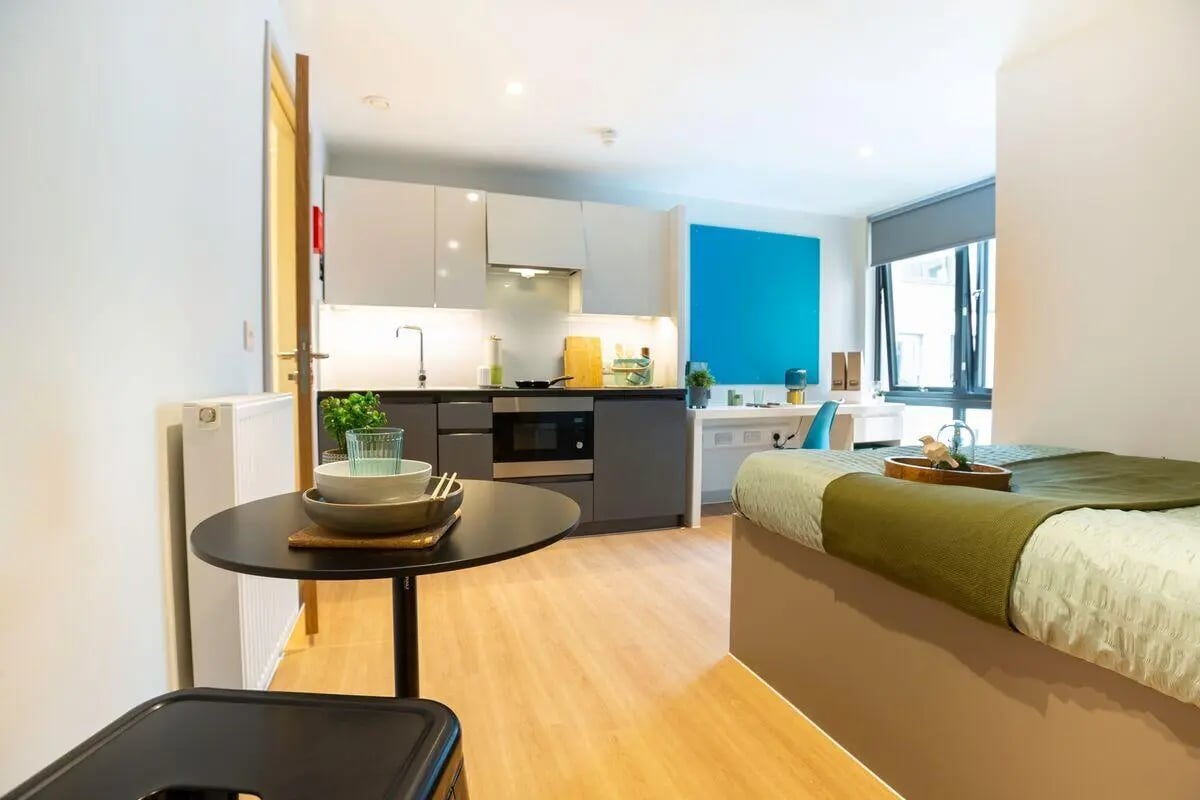 Table kitchen sink bed and desk Studio at Market Quarter Studios in Bristol Student Accommodation