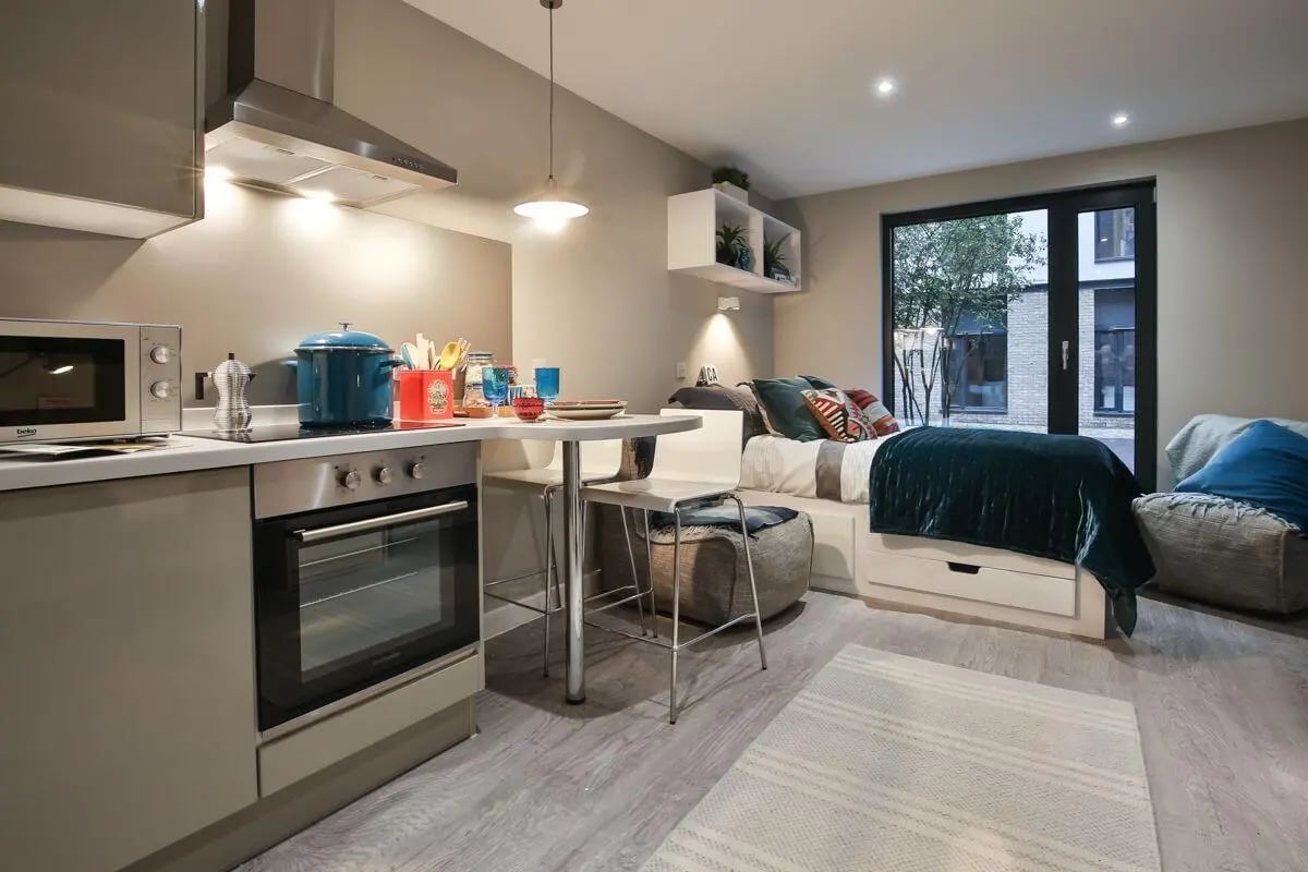 Kitchen oven microwave bed and table studio apartment at King's Stables Road in Edinburgh Student Accommodation