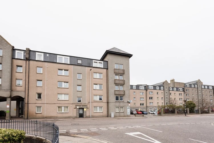 Apartment building with windows balconies and cars exterior at Spring Gardens in Aberdeen Student Accommodation