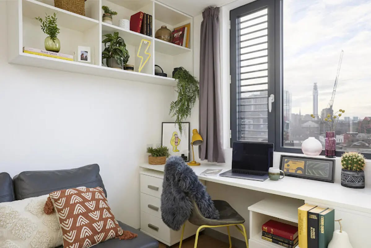 Desk sofa and shelves with decorations study area at Staniforth House in Birmingham Student Accommodation