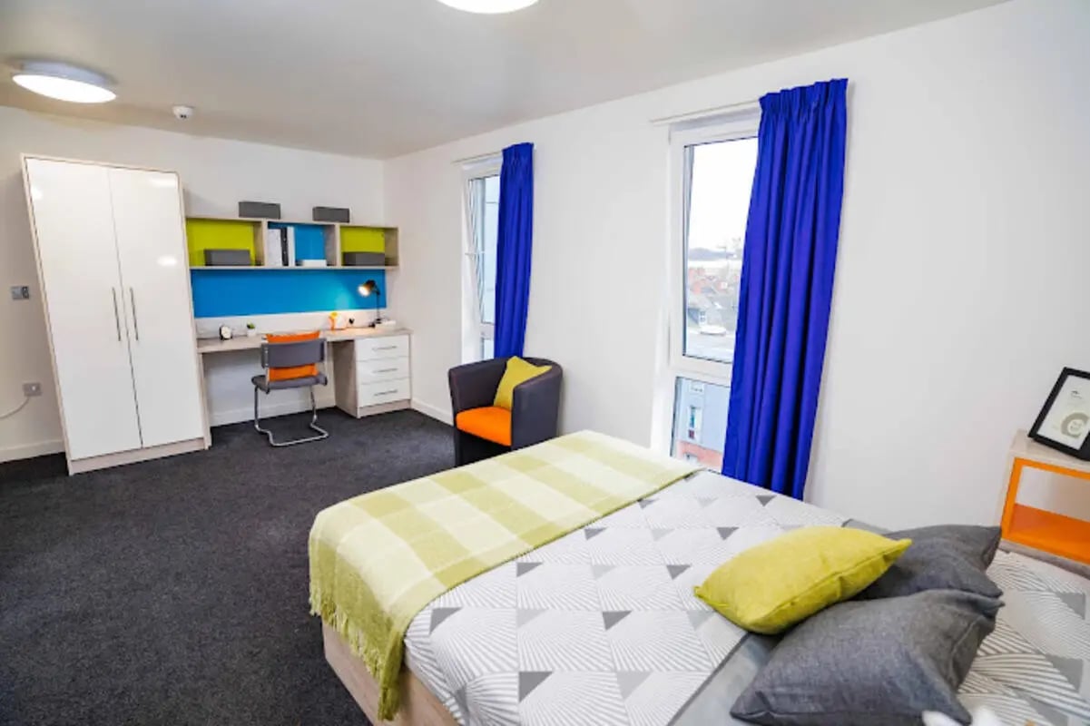 Bed wardrobe desk chair and chair bedroom at Queen's Park House in Coventry Student Accommodation