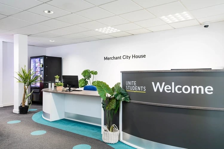 Welcome desk with plants and vending machine reception at Merchant City House in Glasgow Student Accommodation
