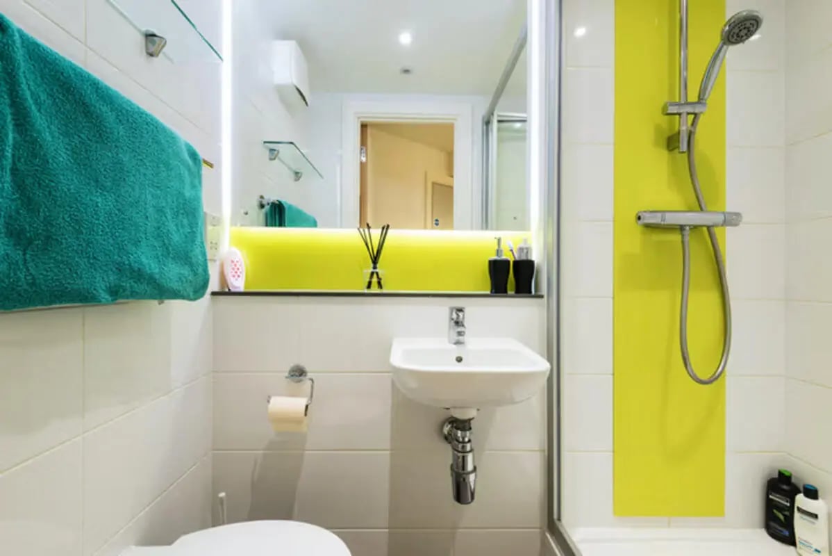 Modern bathroom with sink toilet and shower. at Lucas Studios in Birmingham Student Accommodation
