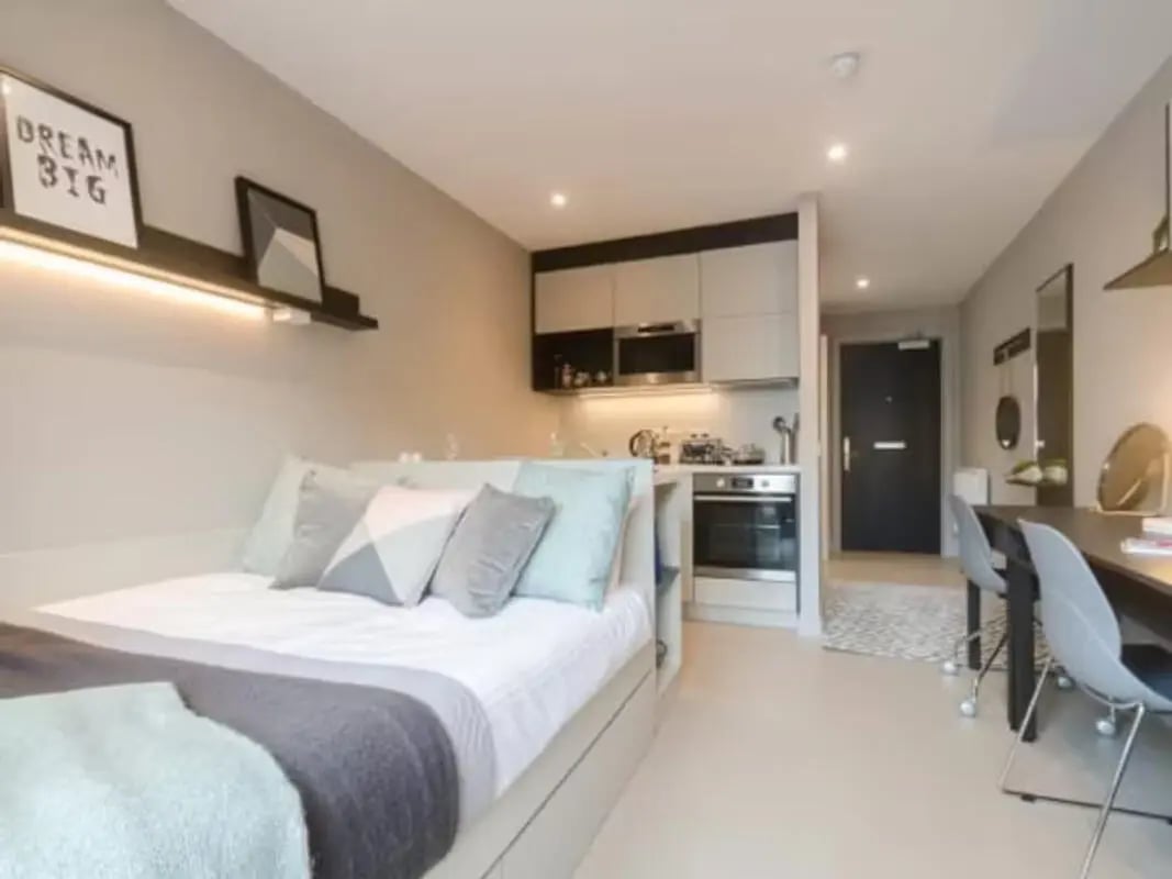 Bed kitchen and desk area studio apartment at Potterrow in Edinburgh Student Accommodation