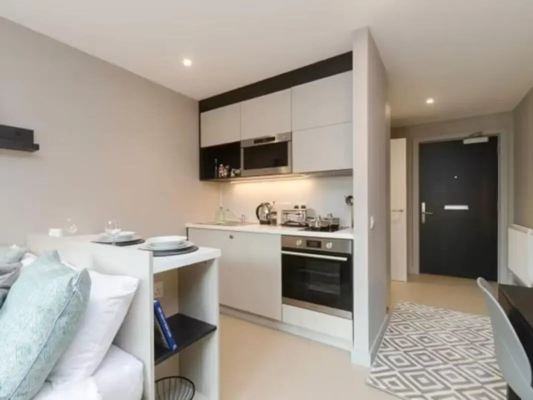 Studio apartment kitchen with bed and dining kitchen area at Potterrow in Edinburgh Student Accommodation