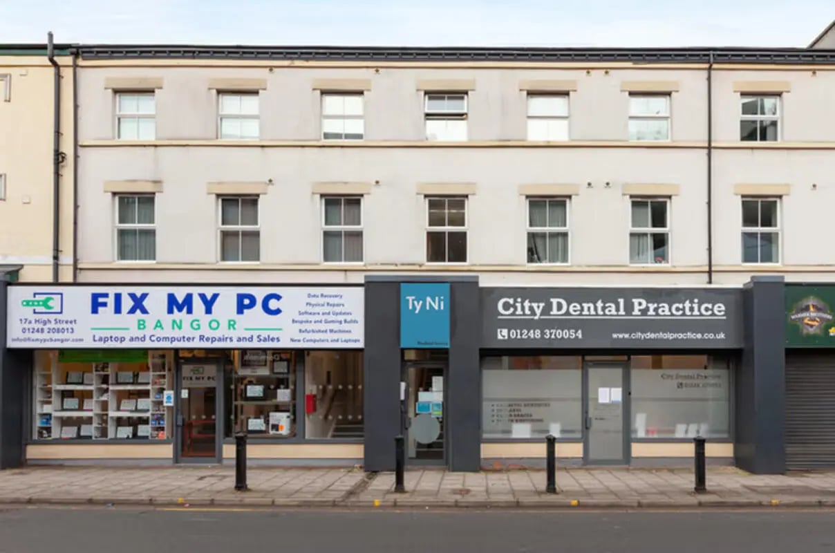 Commercial building facade with shops below and apartments above Exterior at Ty Ni in Bangor Student Accommodation