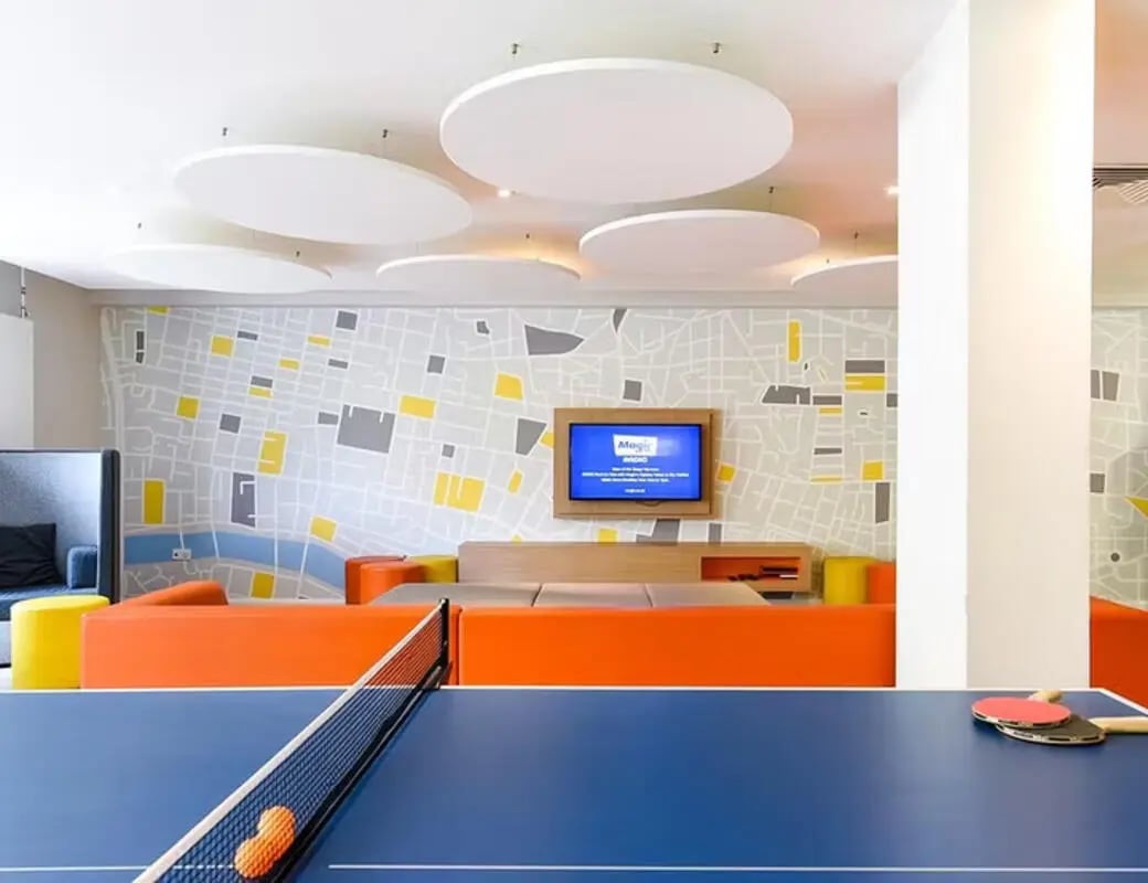 Ping pong table with paddles balls and seating area living room at Merchant Studios in Glasgow Student Accommodation