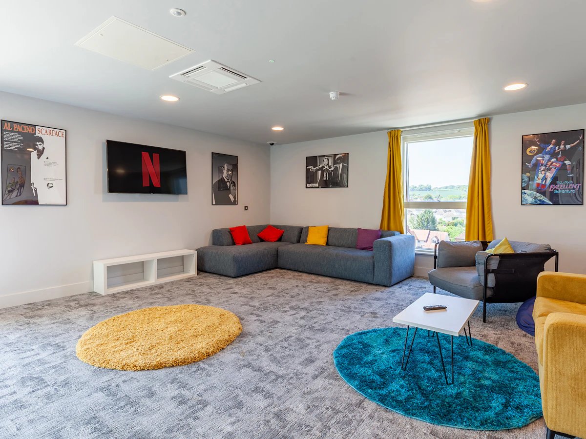 Corner sofa TV posters rugs living room at West Way Square in Oxford Student Accommodation